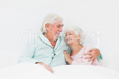 Elderly couple in bed