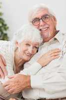 Couple embracing on couch