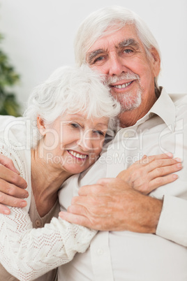 Smiling couple on the couch