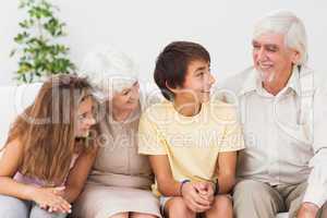 Grandparents with grandchildren chatting