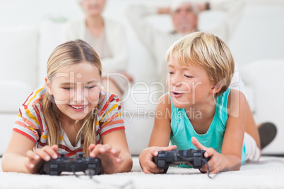 Siblings playing video games