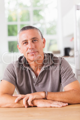 Man smiling in kitchen