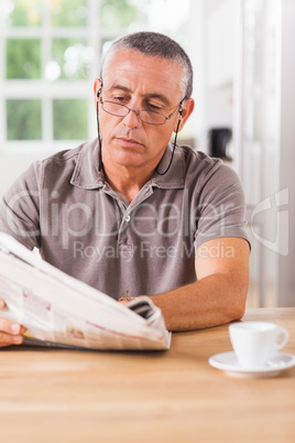 Man reading newspaper