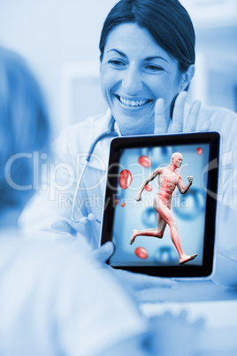 Smiling doctor showing a tablet computer to a child