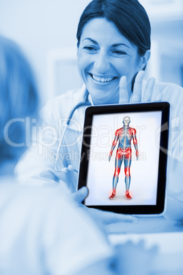 Smiling doctor showing a tablet computer to a child