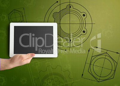 Tablet on green background