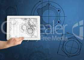 Hand holding tablet with architect illustrations