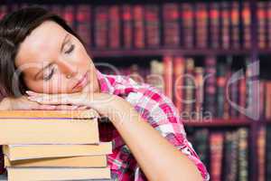 Woman sleeping on books