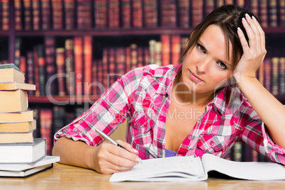 Woman writing on notebook