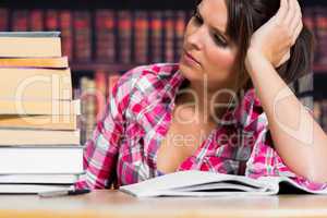 Woman thinking in the library