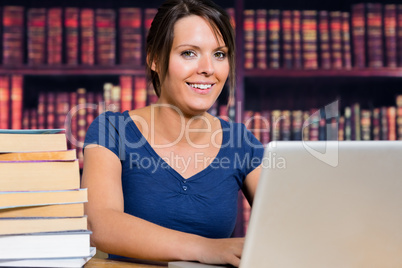 Smiling woman with a computer