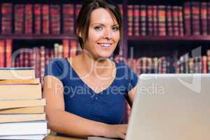 Smiling woman with a computer