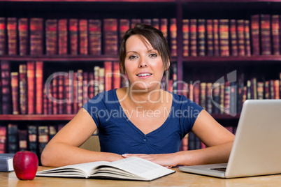 Smiling student in library