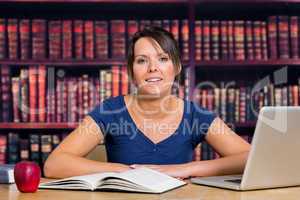 Smiling student in library