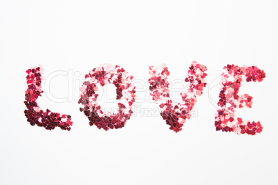 Pink confetti spelling out love
