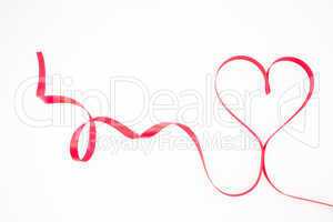 Decorative pink ribbon shaped into heart