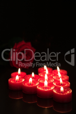 Romantic candles with red rose