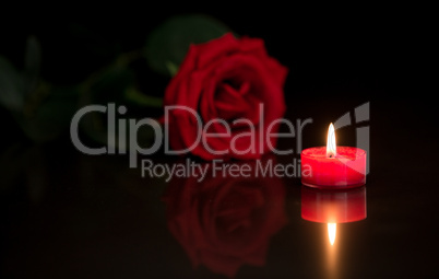 Romantic candle with red rose