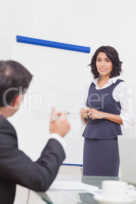 Businessman posing a question to a manager