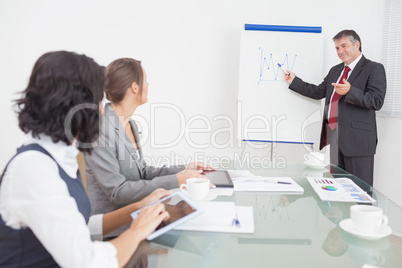 Businessman listening to a question and explaining with smile