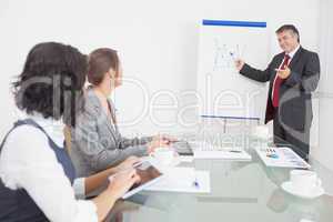 Businessman listening to a question and explaining with smile