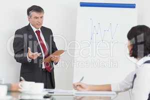 Businessman explaining to his colleague