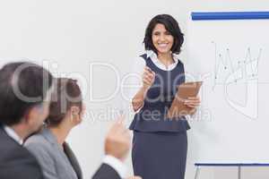 Businesswoman pointing with her pen