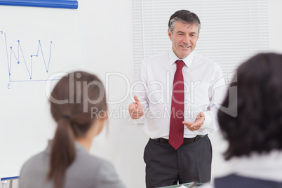 Businessman talking with gestures and smile