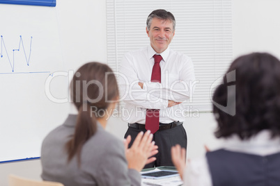 Businessman crossing his arms with a smile