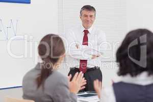 Businessman crossing his arms with a smile