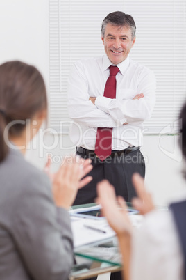 Businessman crossing his arms with a big smile