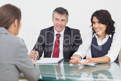 Business people talking in a small meeting