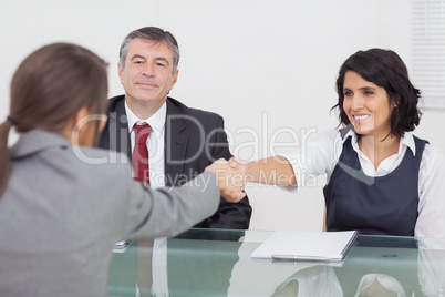 Two businesswomen shaking hands