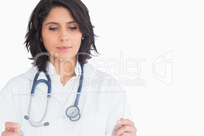 Doctor looking at virtual screen