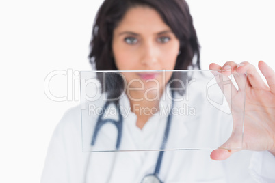 Doctor holding up virtual screen in hands