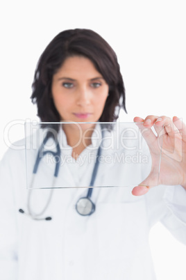 Doctor looking at virtual clear screen