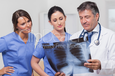 Doctor and nurses looking x-ray