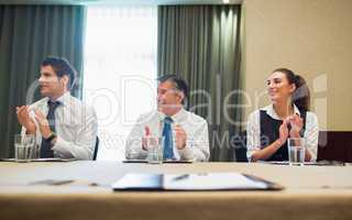 Business people clapping after presentation