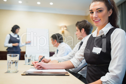 Smiling businesswoman during a presentation Smiling businesswoman during a presentation