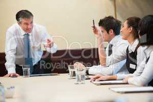Woman asking question in a business meeting