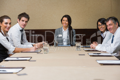 Smiling business team at conference