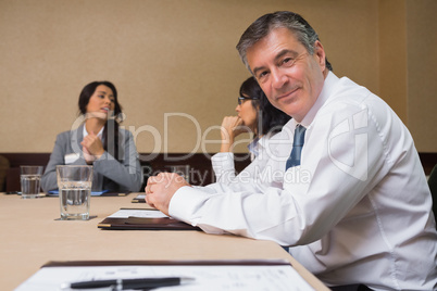 Happy businessman at meeting