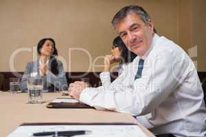 Happy businessman at meeting