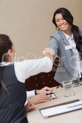 Businesswomen shaking hands