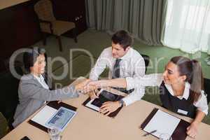 Businesswomen reaching agreement