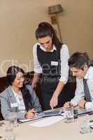 Businesswoman showing something on tablet