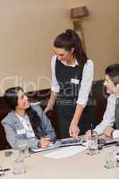 Businesswoman using tablet in meeting