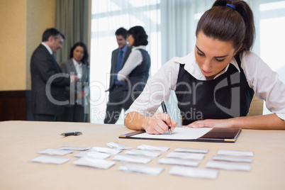 Businesswoman working at welcome desk