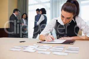 Businesswoman working at welcome desk