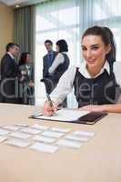 Happy woman at welcome desk